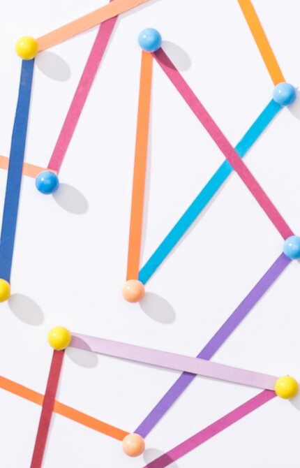 A decorative image - a close-up of a bunch of coloured paper sticks connected to each other 